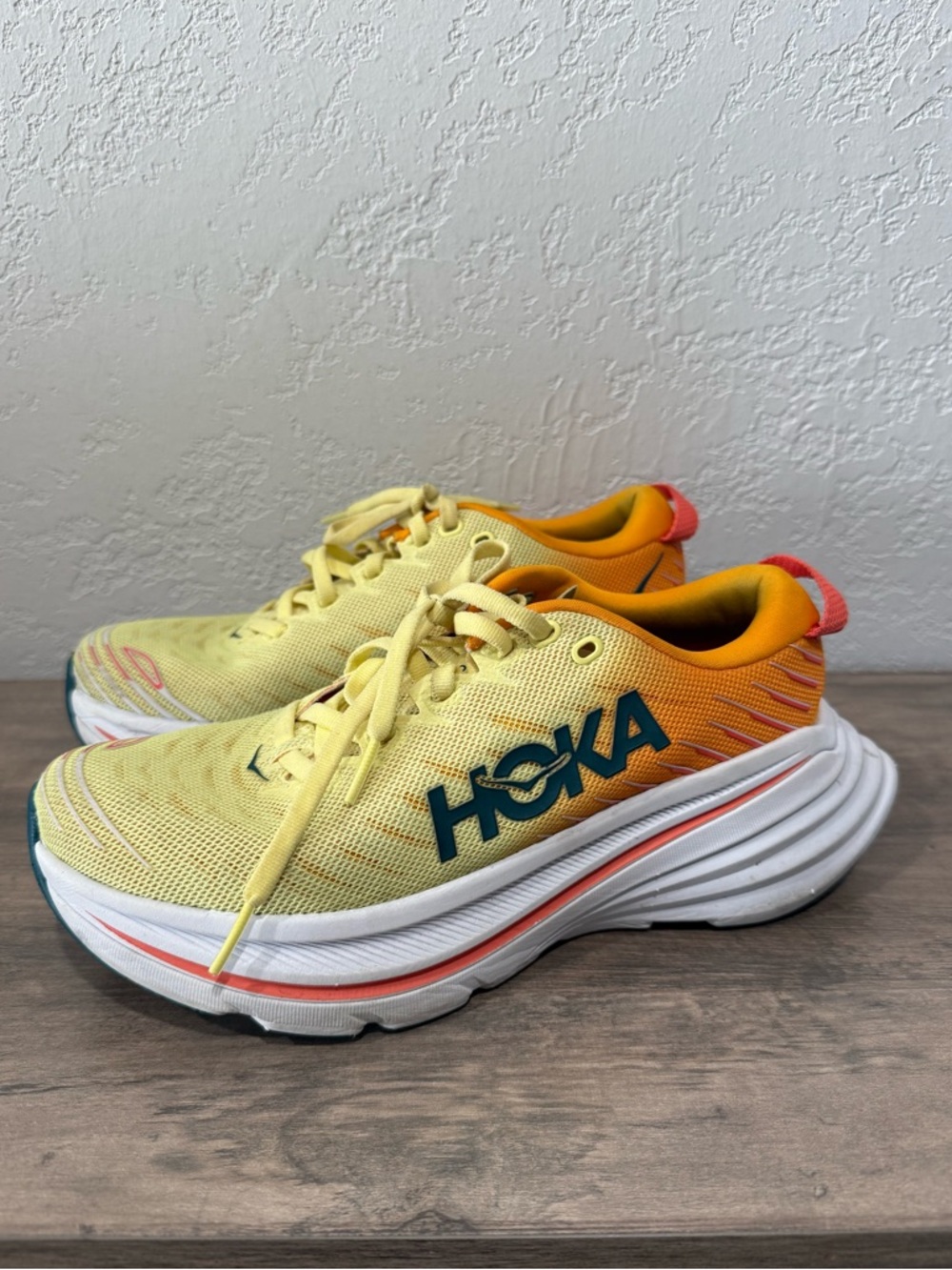 Hoka Bondi X Yellow and Orange Running Shoes with Teal Logo